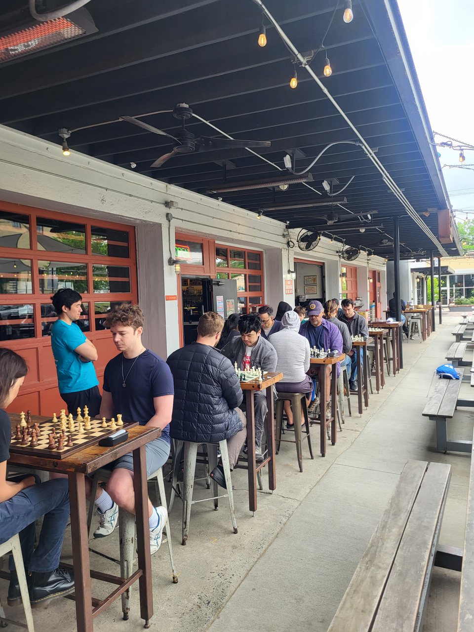 Players competing in the April blitz tournament at Parts and Labor.