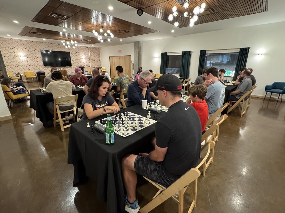 Subhash KV and players at the Mid-Summer Mate Rapid Tournament.